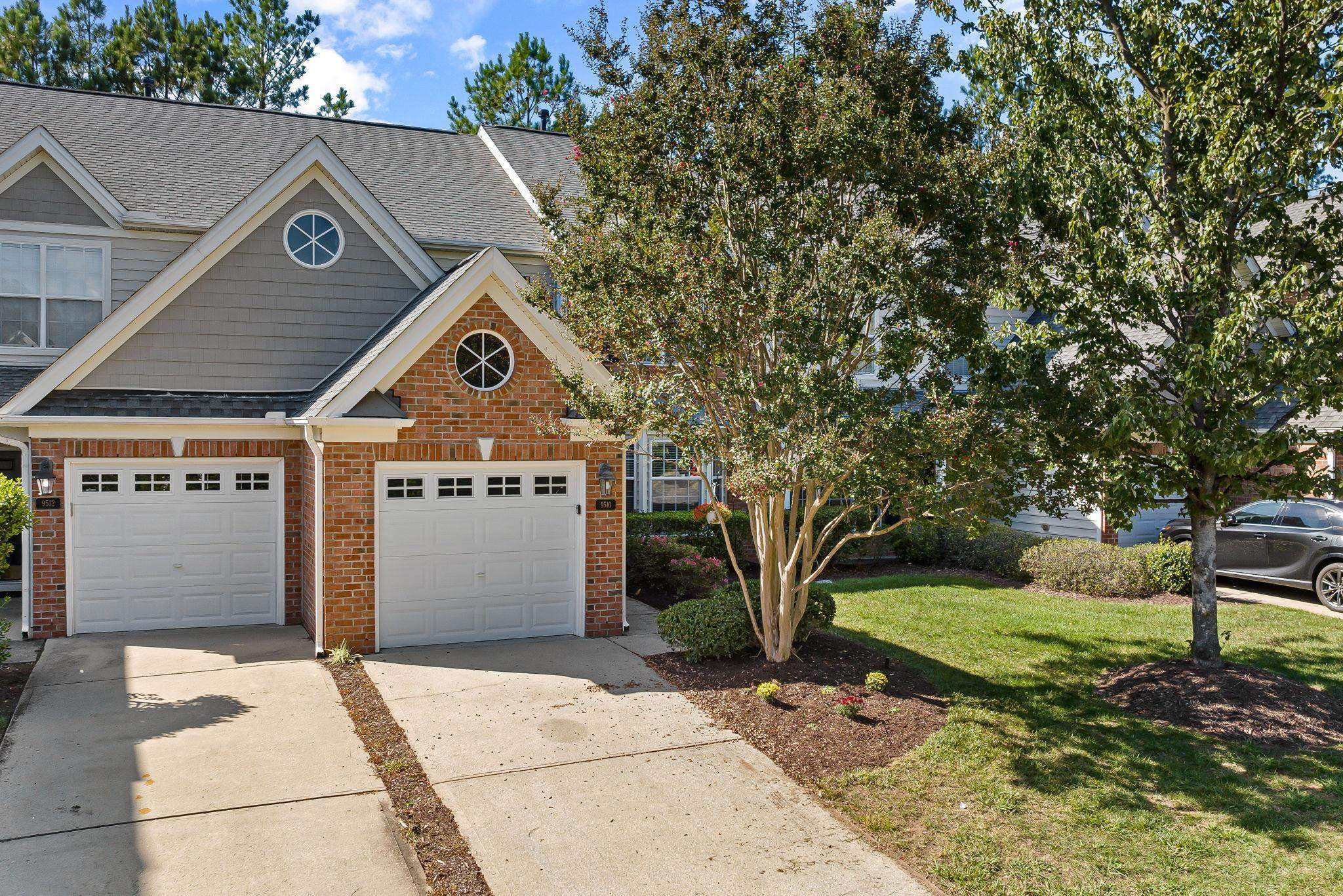 9510 Lost Key Court Raleigh, NC 27617 - Photo 4 of 46 a front view of a house with a yard