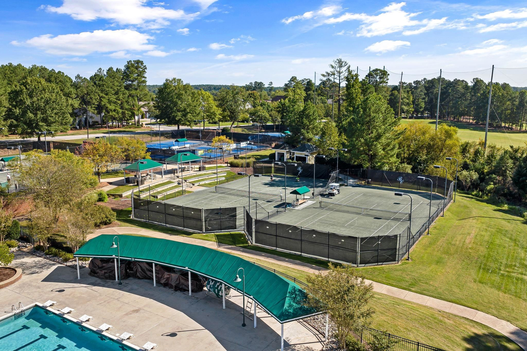 9510 Lost Key Court Raleigh, NC 27617 - Photo 42 of 46 a view of a swimming pool with lawn chairs under an umbrella