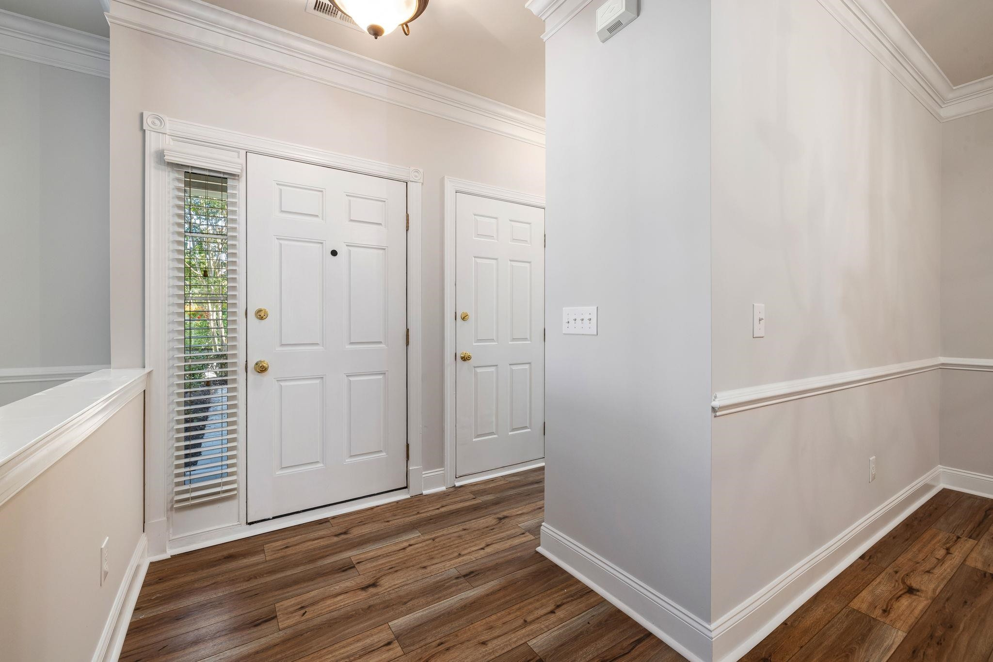 9510 Lost Key Court Raleigh, NC 27617 - Photo 8 of 46 a view of a hallway with wooden floor