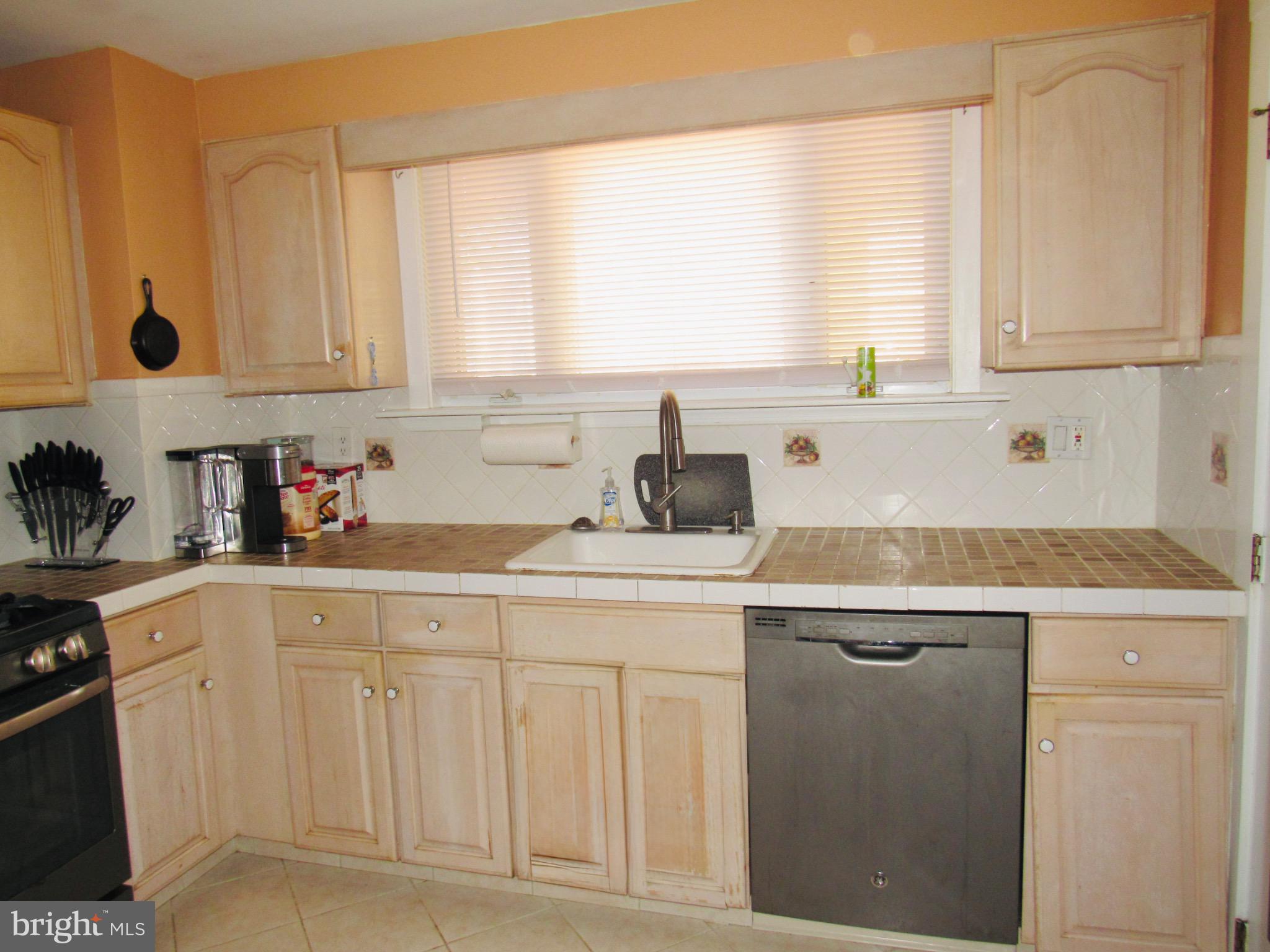 306 South State Road Upper Darby, PA 19082 - Photo 17 of 58 a kitchen with white cabinets and sink