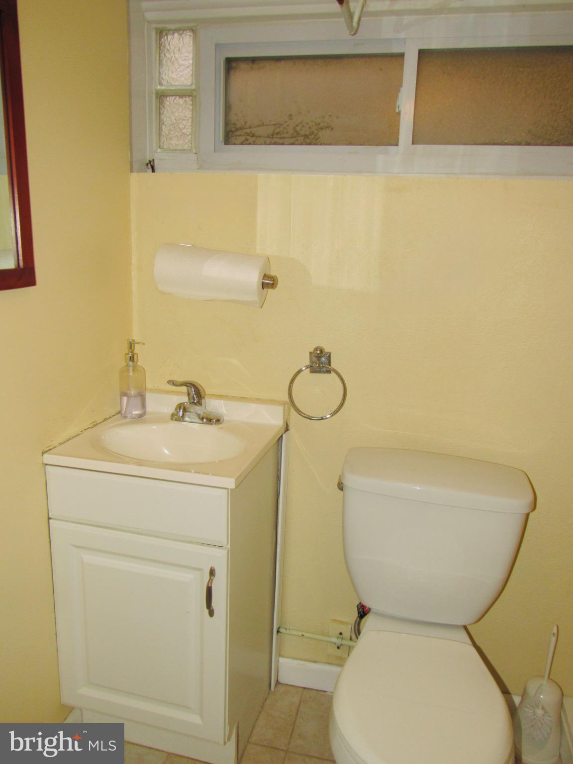 306 South State Road Upper Darby, PA 19082 - Photo 31 of 58 a bathroom with a toilet sink and mirror