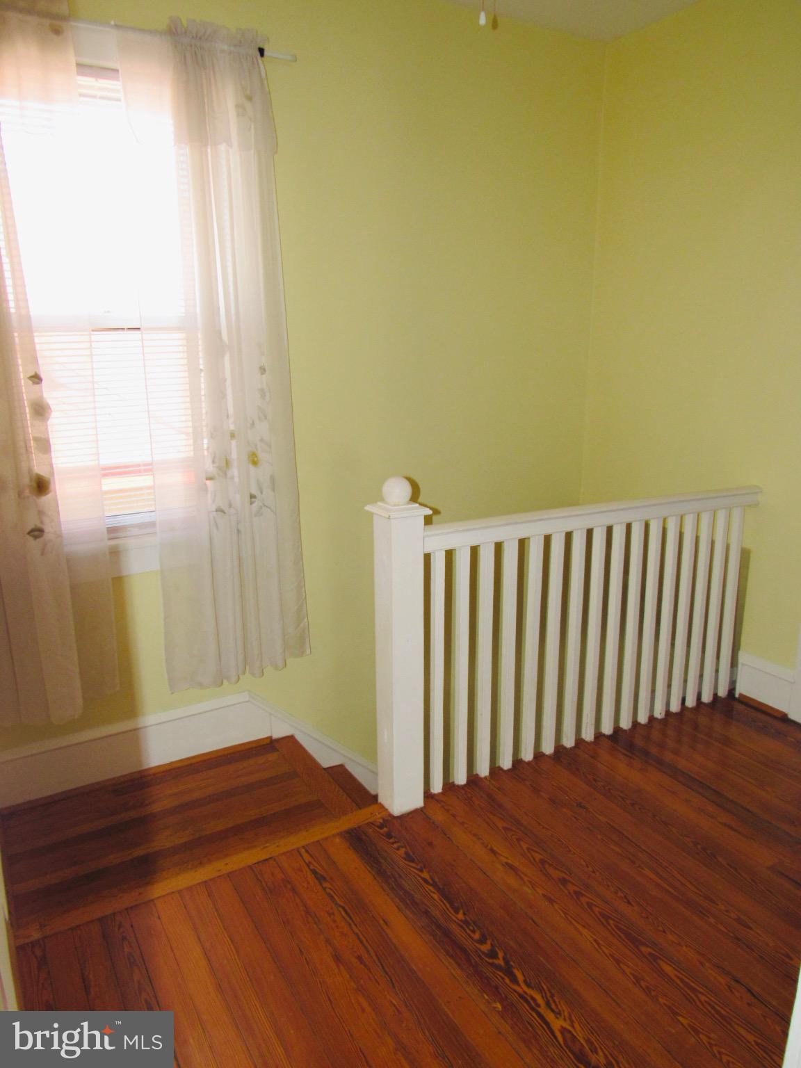 306 South State Road Upper Darby, PA 19082 - Photo 38 of 58 a view of a room with wooden floor and a chair