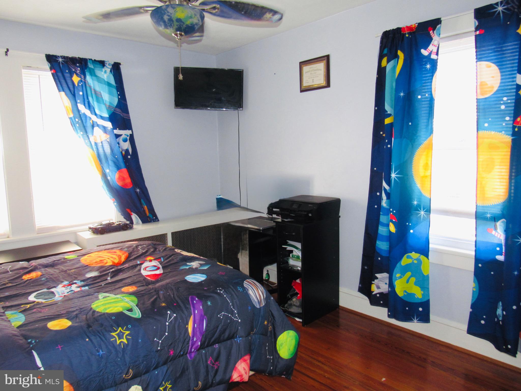 306 South State Road Upper Darby, PA 19082 - Photo 42 of 58 a bedroom with a bed and wooden floor