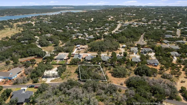 an aerial view of residential houses with city view