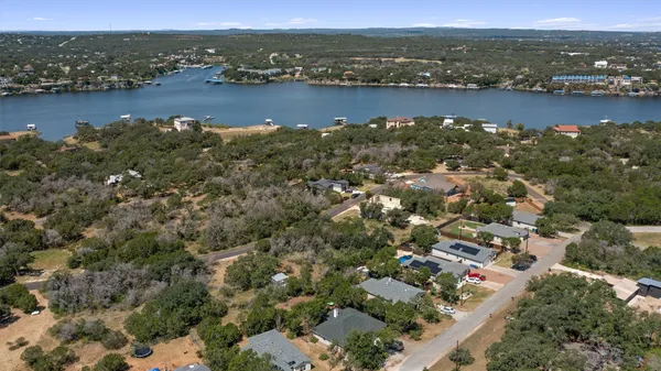 an aerial view of a houses with ocean view