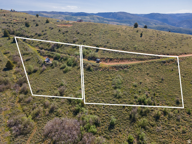 3325 North Oak Cyn Road, Unit 490 Huntsville, UT 84317 - Photo 24 of 25 Expansive hillside parcels featuring a dirt road, mature vegetation, and distant mountain scenery
