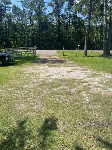 a view of outdoor space with deck and trees