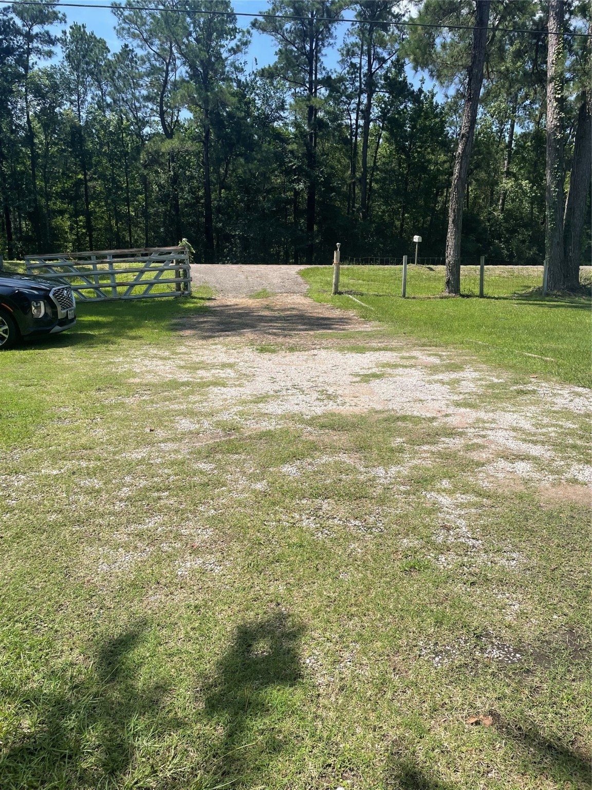 2365 U.S. Highway 190 Huntsville, TX 77340 - Photo 3 of 12 a view of outdoor space with deck and trees