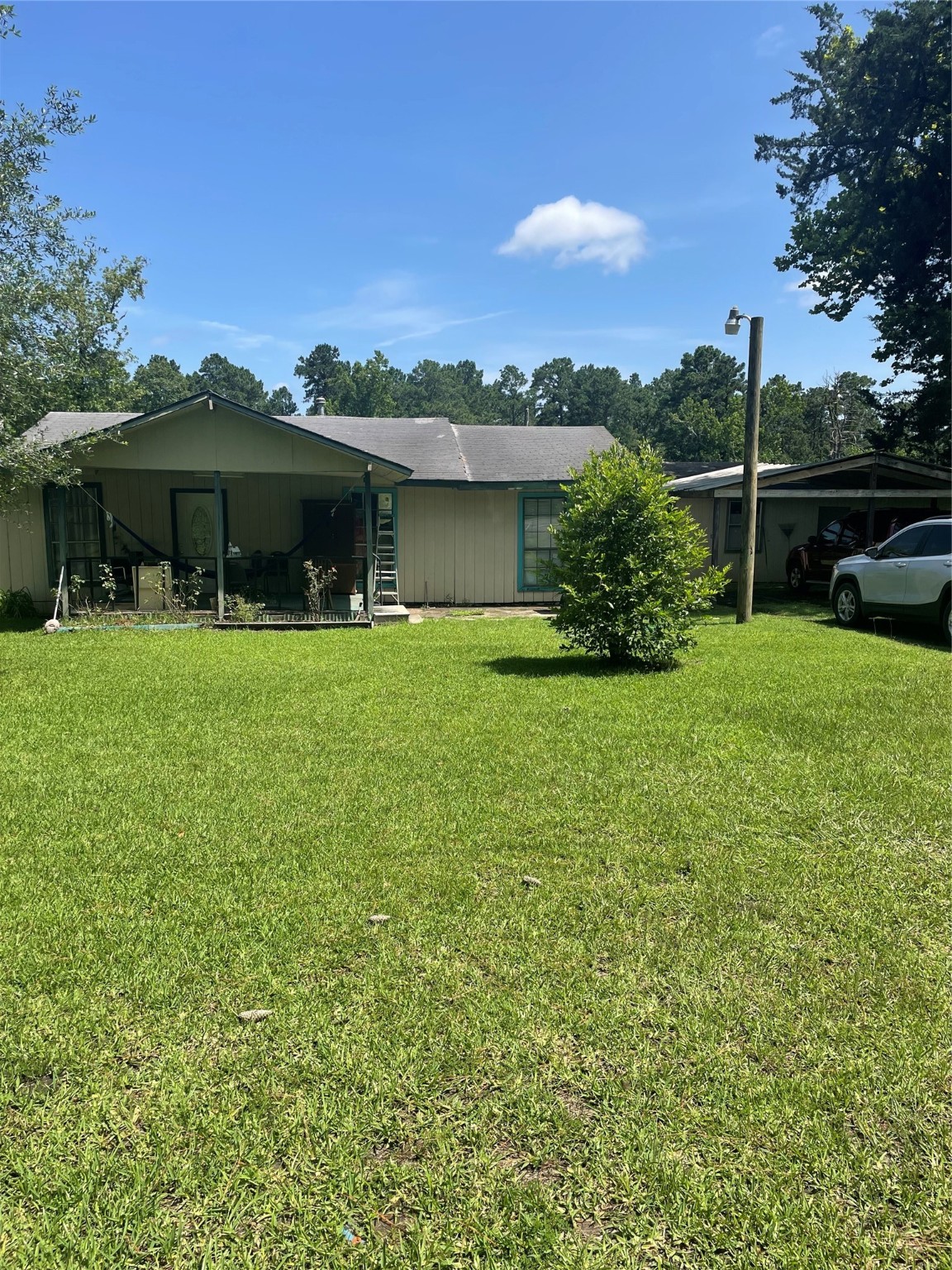 2365 U.S. Highway 190 Huntsville, TX 77340 - Photo 4 of 12 a view of a house with a yard