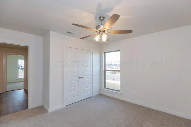 a bathroom with a granite countertop sink mirror and vanity
