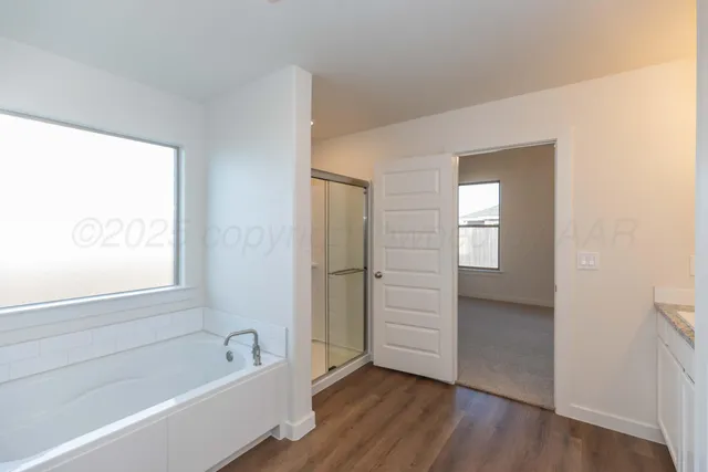 a view of bathroom with a toilet a sink and a mirror