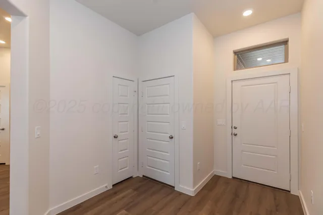 a view of kitchen with sink and wooden floor