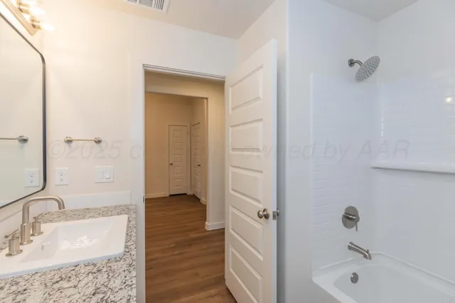 a view of an empty room with a window