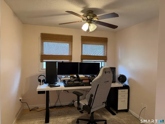 a view of a workspace with furniture