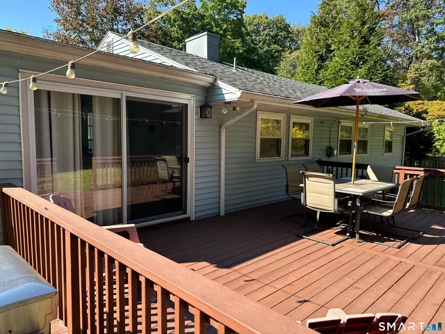 a balcony with table and chairs