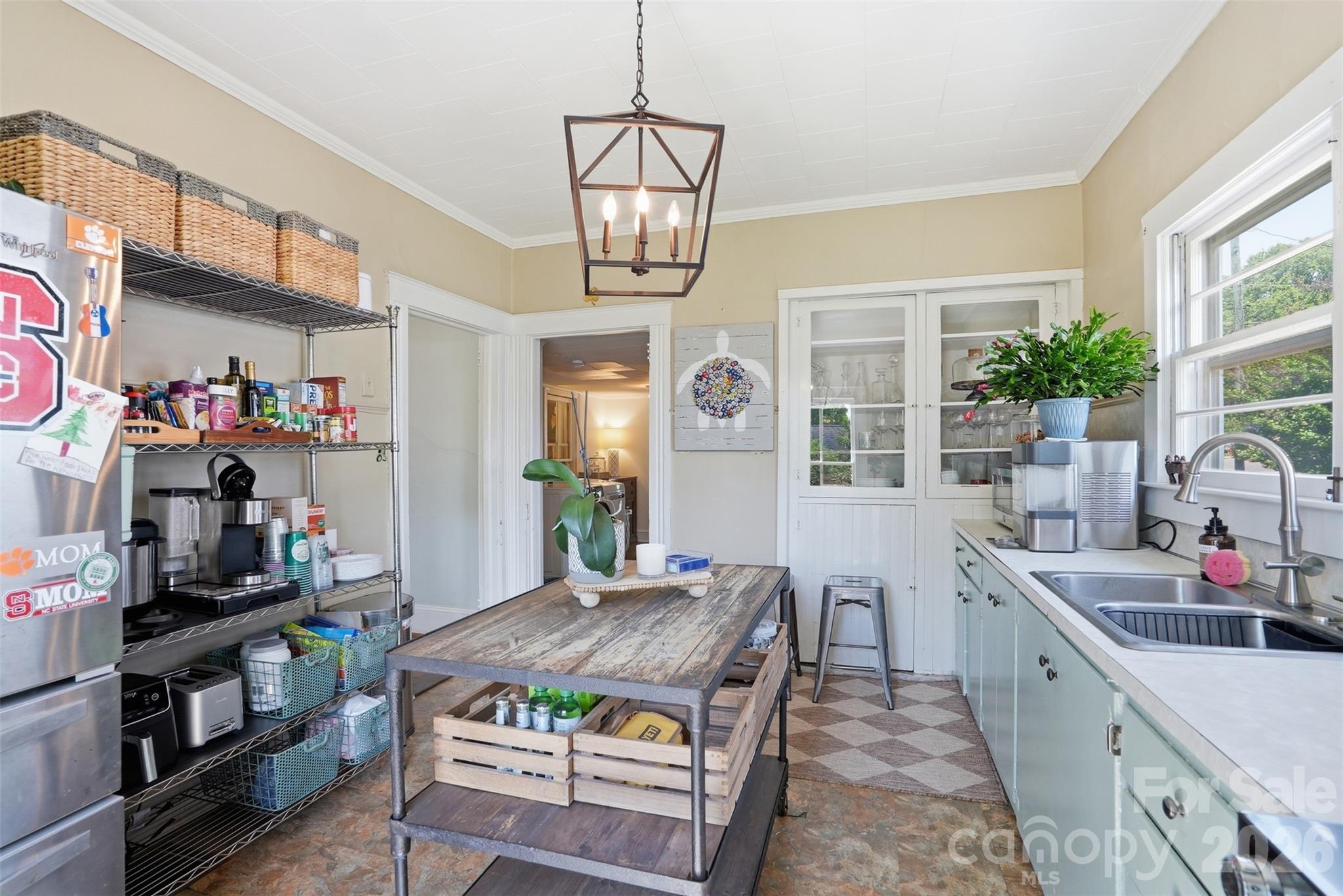 303 South Street Davidson, NC 28036 - Photo 12 of 37 a kitchen with a stove and a wooden floor