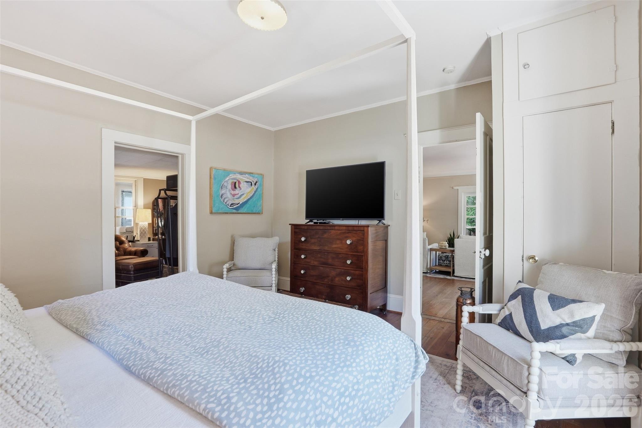 303 South Street Davidson, NC 28036 - Photo 20 of 37 a bedroom with a bed and a flat screen tv