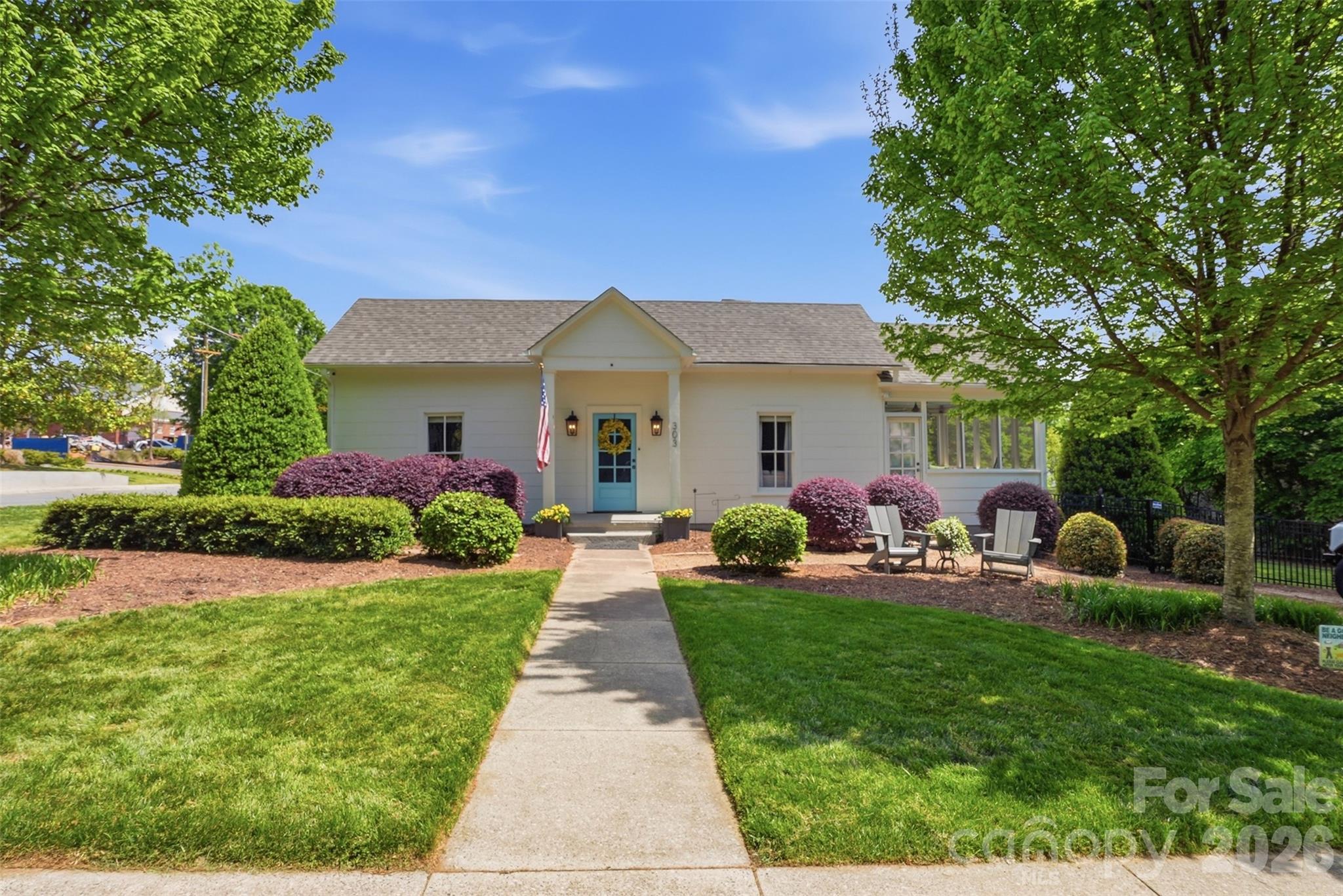303 South Street Davidson, NC 28036 - Photo 2 of 37 a front view of a house with garden