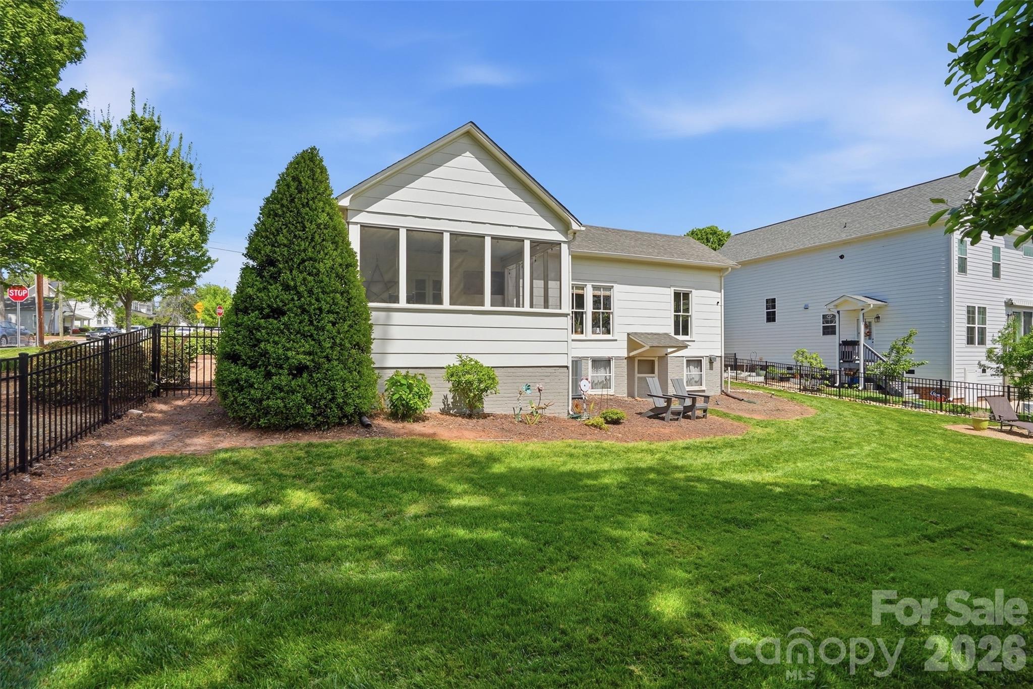 303 South Street Davidson, NC 28036 - Photo 27 of 37 a front view of a house with a yard