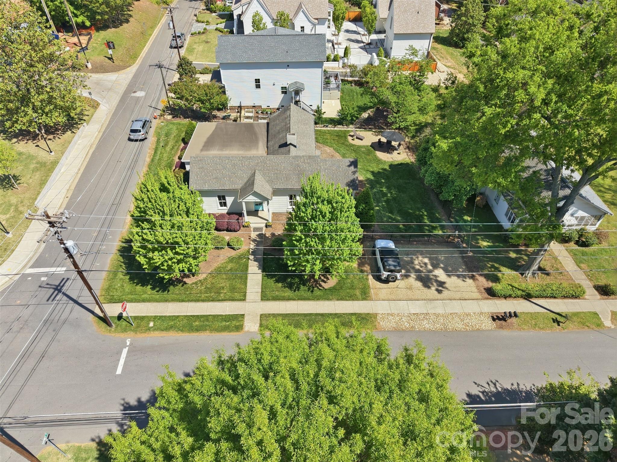 303 South Street Davidson, NC 28036 - Photo 28 of 37 an aerial view of a house with a yard and garden