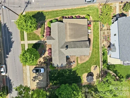 a aerial view of a house with table and chairs