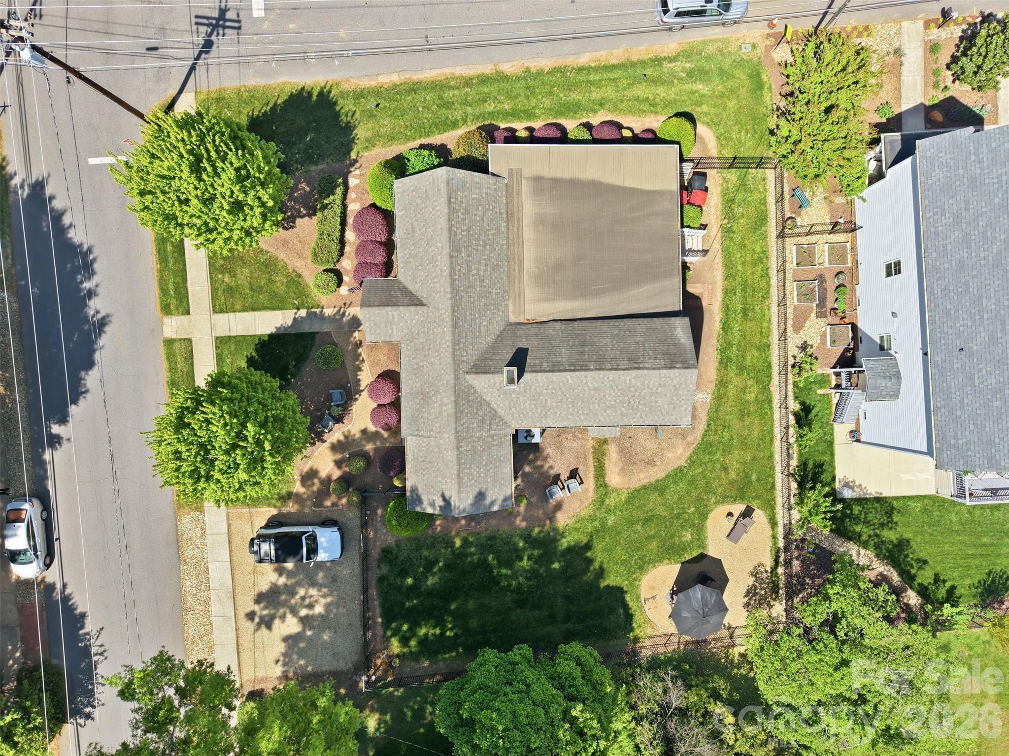 303 South Street Davidson, NC 28036 - Photo 30 of 37 a aerial view of a house with table and chairs