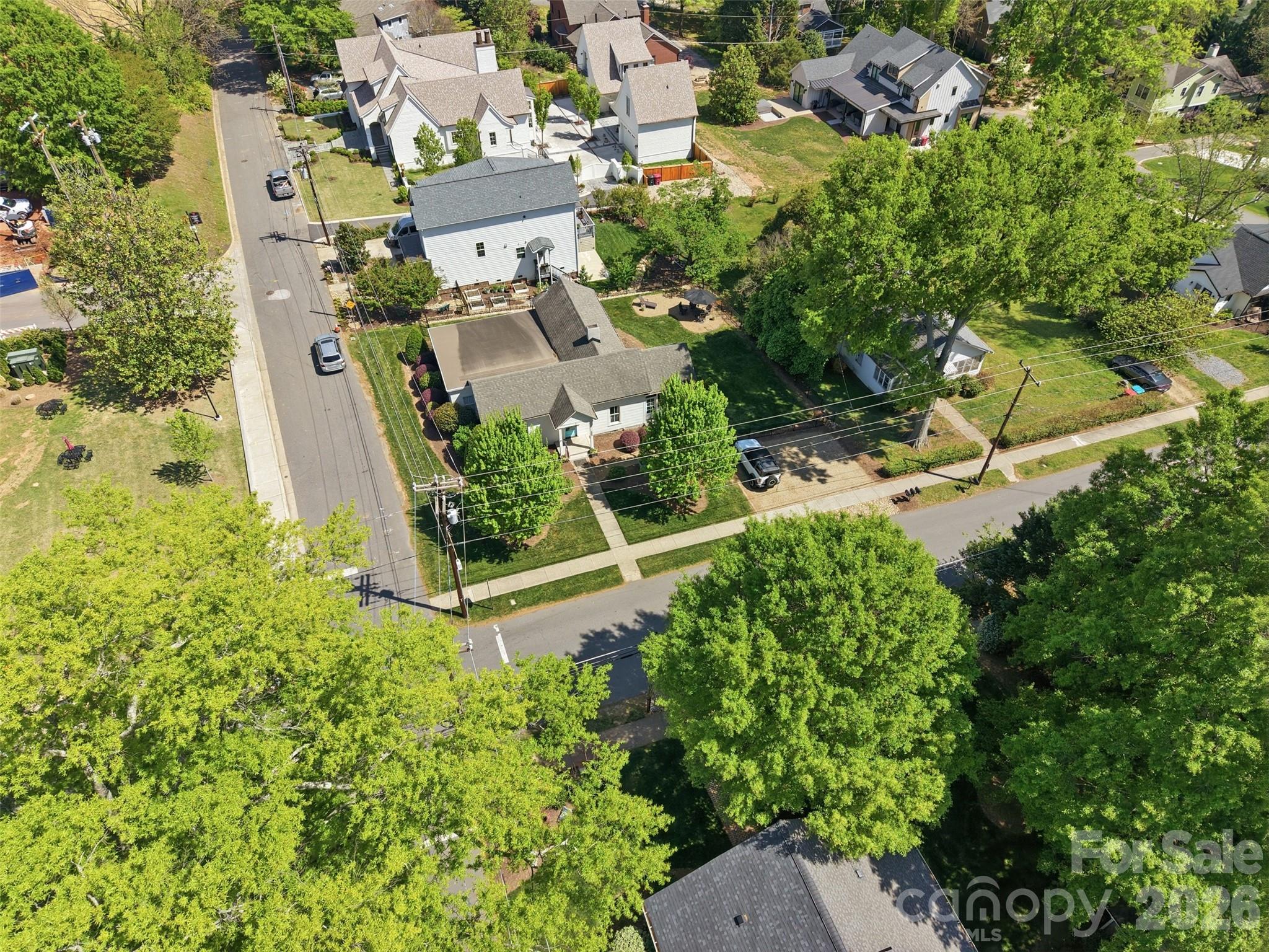 303 South Street Davidson, NC 28036 - Photo 35 of 37 an aerial view of a house with a yard and lake view