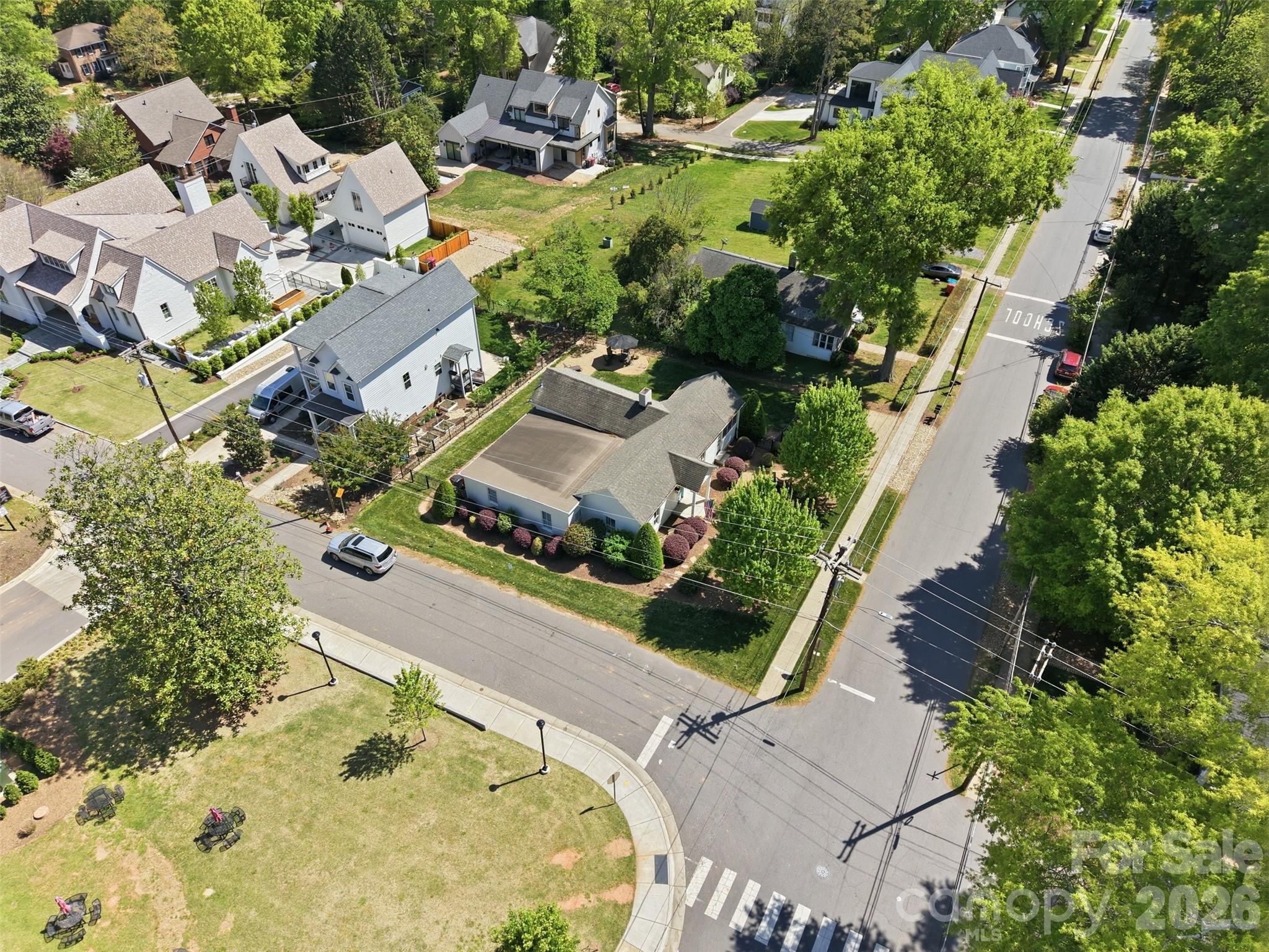 303 South Street Davidson, NC 28036 - Photo 36 of 37 an aerial view of a house with a yard and lake view