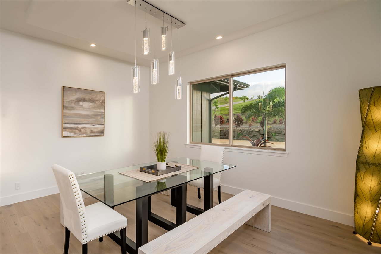 940 Auwaha Street, Unit A Haiku, HI 96708 - Photo 12 of 28 a view of a dining room with furniture and wooden floor