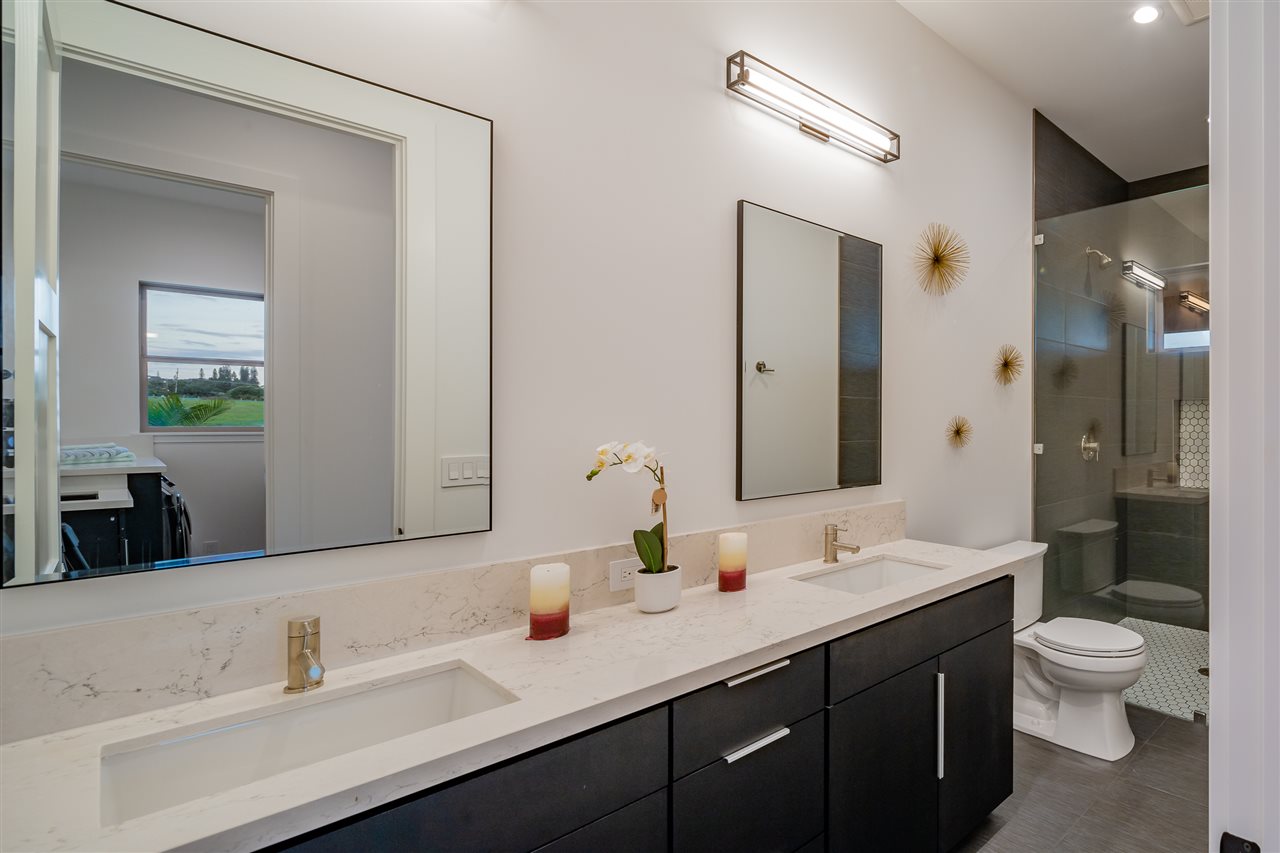 940 Auwaha Street, Unit A Haiku, HI 96708 - Photo 15 of 28 a bathroom with a double vanity sink toilet and a mirror