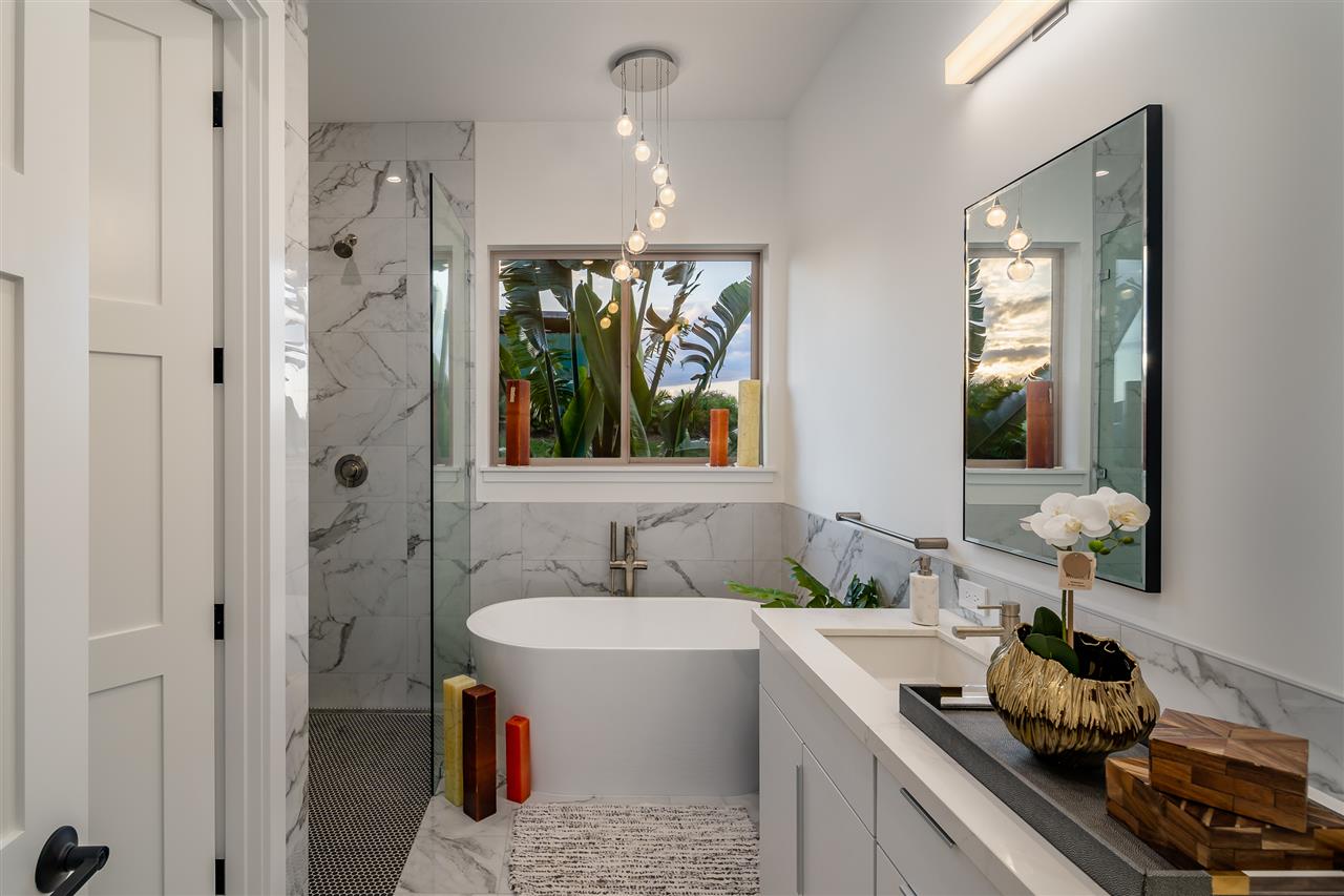 940 Auwaha Street, Unit A Haiku, HI 96708 - Photo 18 of 28 a bathroom with a double vanity sink and a mirror