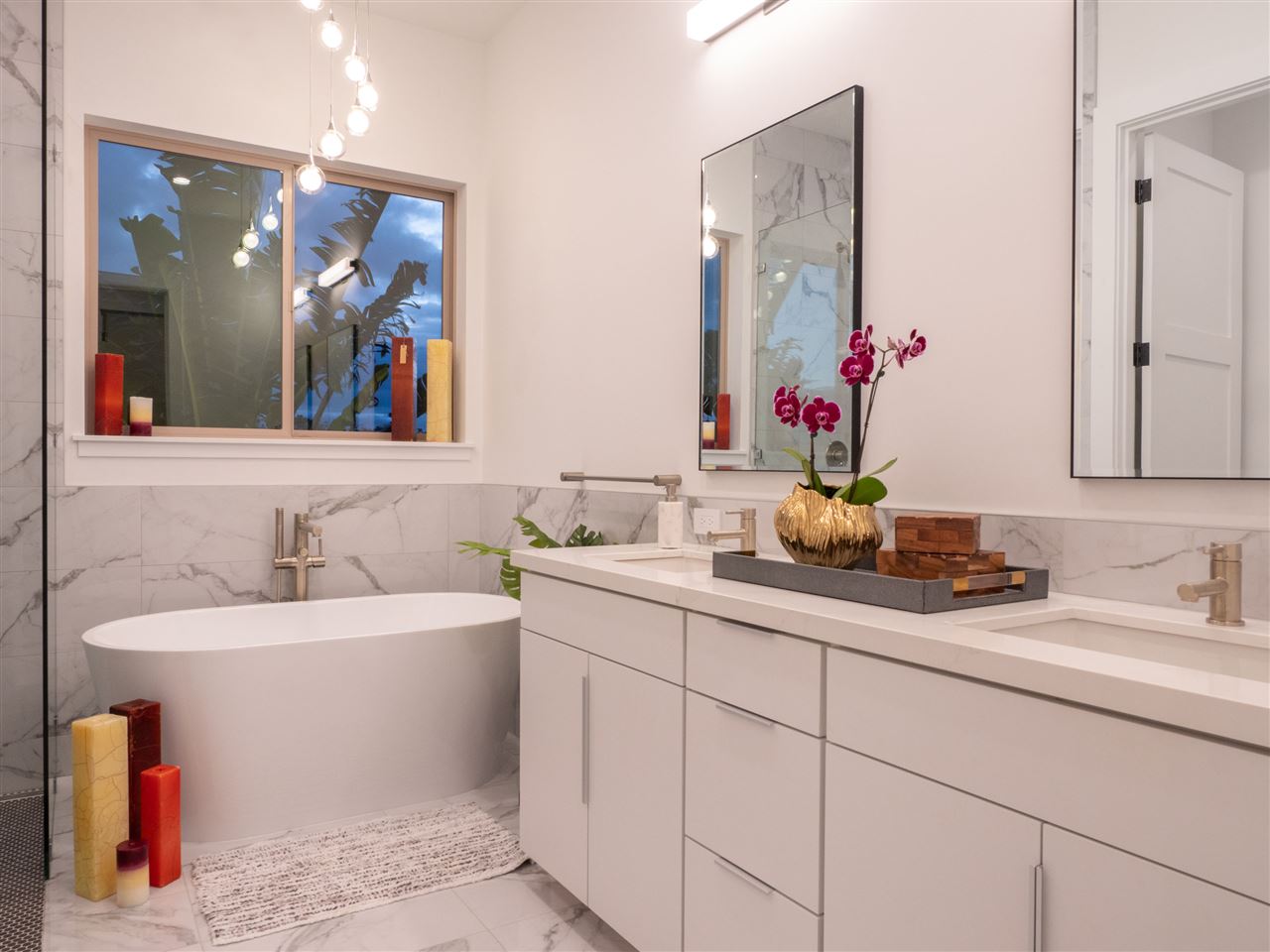 940 Auwaha Street, Unit A Haiku, HI 96708 - Photo 19 of 28 a bathroom with a double vanity sink and a mirror