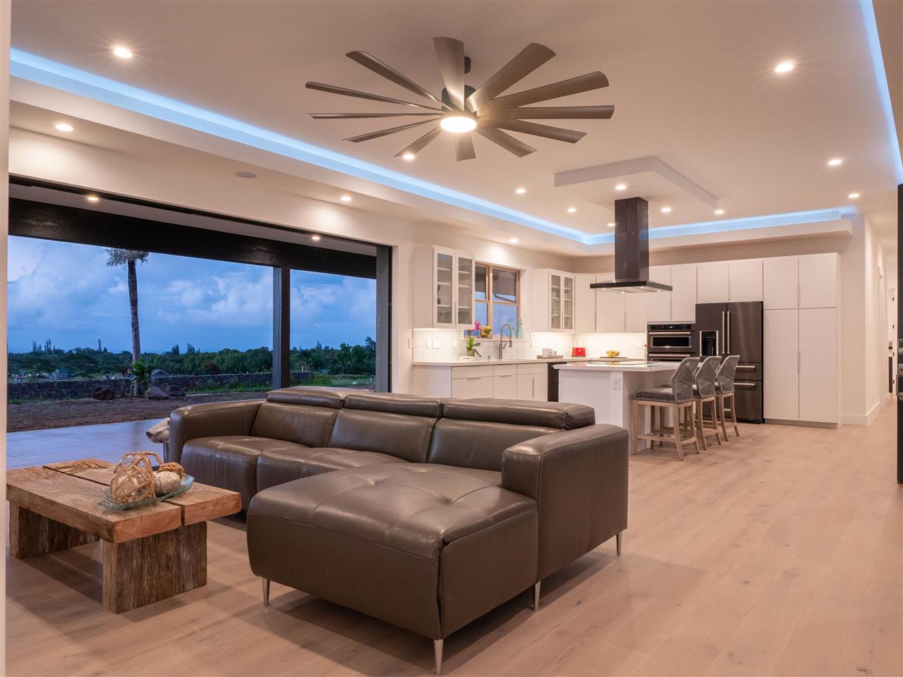 940 Auwaha Street, Unit A Haiku, HI 96708 - Photo 22 of 28 a living room with furniture and a large window