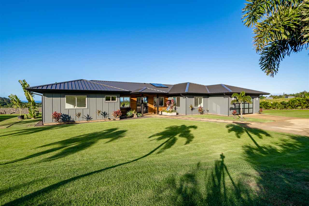 940 Auwaha Street, Unit A Haiku, HI 96708 - Photo 23 of 28 a view of swimming pool with a garden and deck