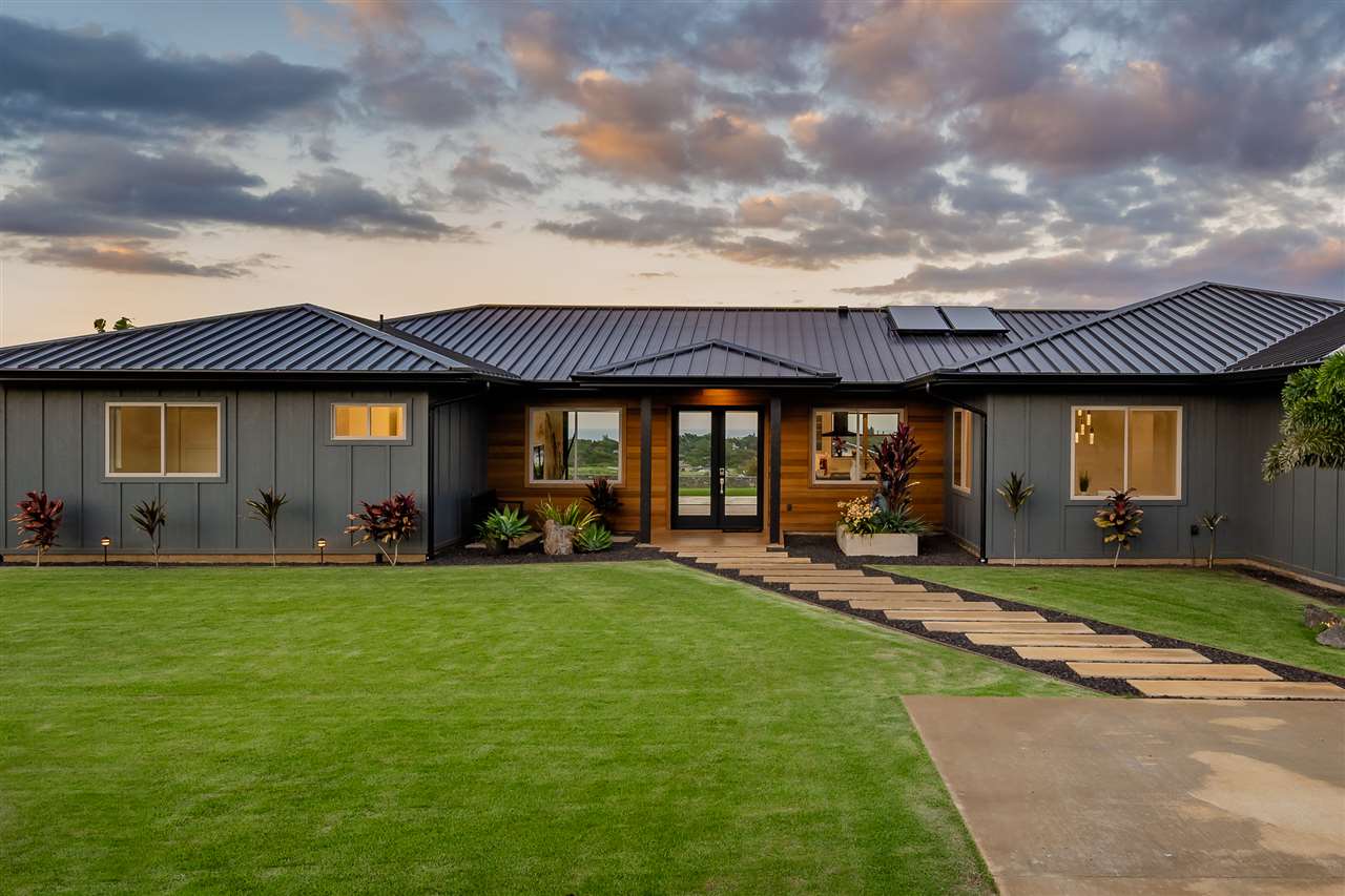 940 Auwaha Street, Unit A Haiku, HI 96708 - Photo 25 of 28 a front view of a house with a yard table and chairs