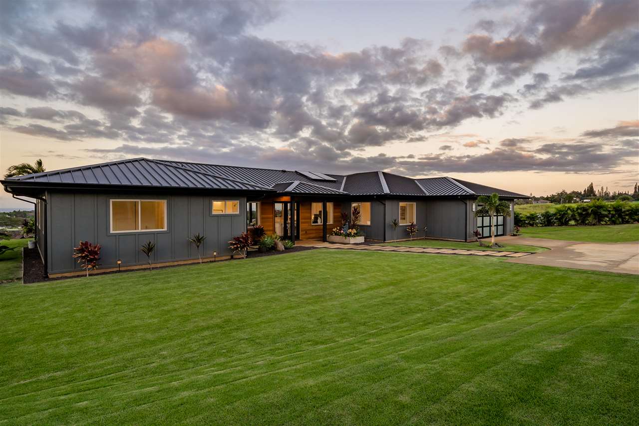 940 Auwaha Street, Unit A Haiku, HI 96708 - Photo 26 of 28 a front view of a house with a garden