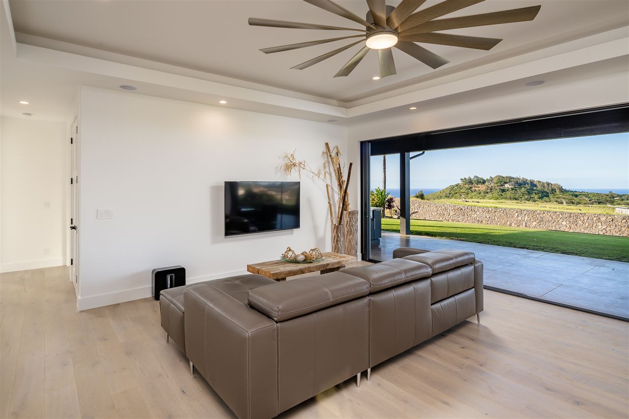 940 Auwaha Street, Unit A Haiku, HI 96708 - Photo 7 of 28 a living room with furniture and a flat screen tv