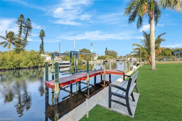 a view of a chairs and table on the deck