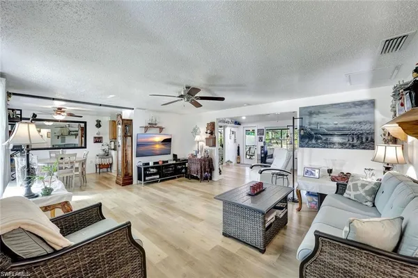a living room with furniture or couch and a table