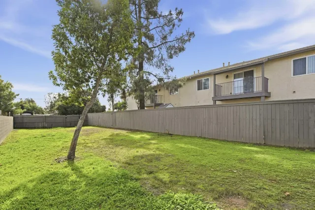 a backyard of a house with lots of green space