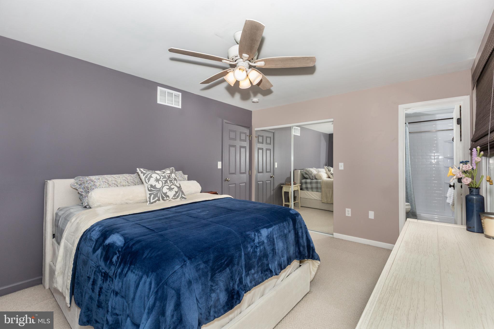 312 Inverness Close Westminster, MD 21158 - Photo 16 of 36 a bedroom with a bed and a chandelier