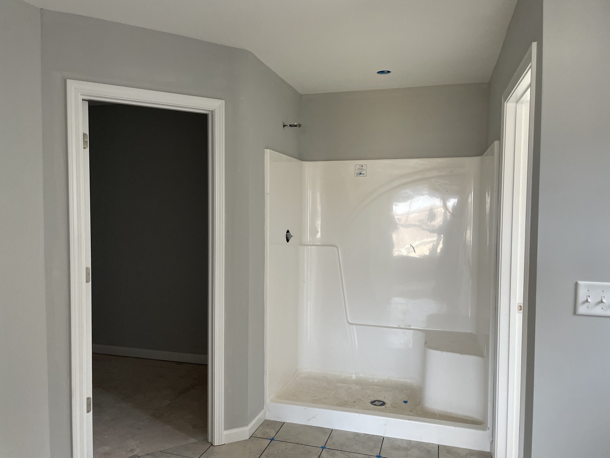 1028 Wiseman Farm Road Fairview, TN 37062 - Photo 7 of 10 a bathroom with a glass shower door