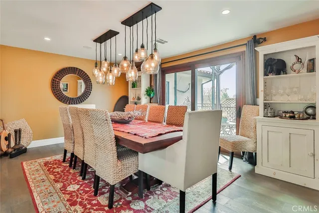 a dining room with furniture and chandelier