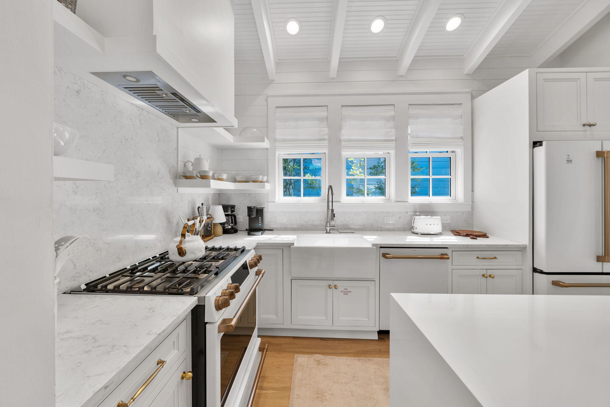 133 Silver Laurel Way Santa Rosa Beach, FL 32459 - Photo 12 of 42 a kitchen with a sink stove and cabinets