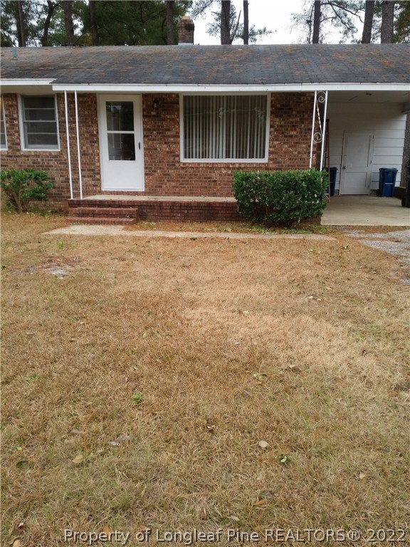 5025 Houston Road Fayetteville, NC 28311 - Photo 2 of 11 a front view of a house with garden