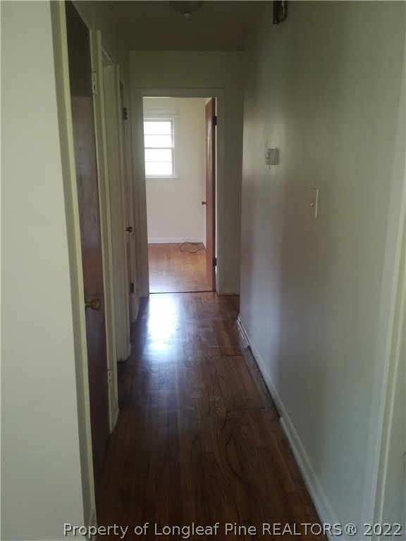 5025 Houston Road Fayetteville, NC 28311 - Photo 6 of 11 a view of a hallway with wooden floor