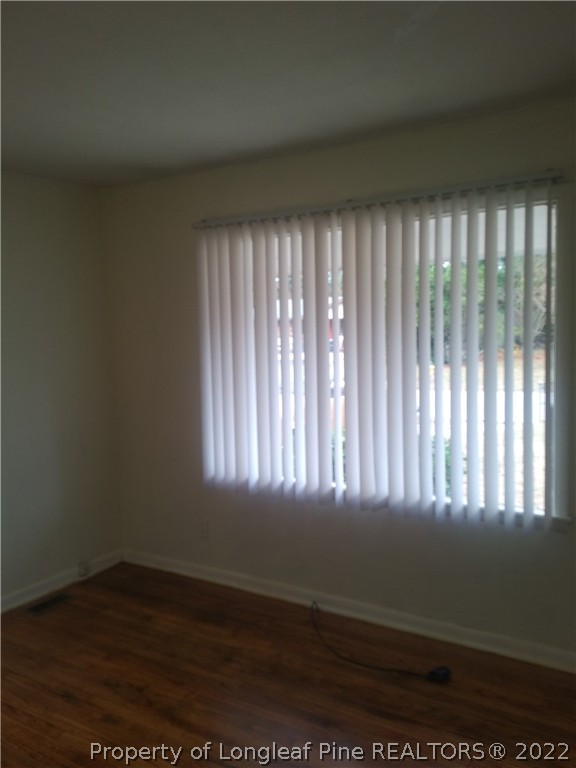 5025 Houston Road Fayetteville, NC 28311 - Photo 7 of 11 a view of an empty room and wooden floor