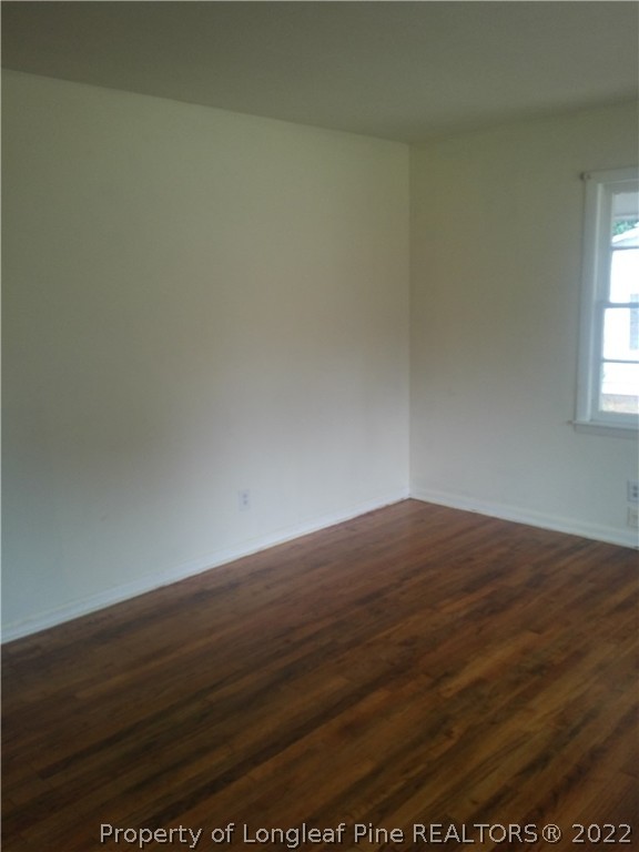 5025 Houston Road Fayetteville, NC 28311 - Photo 8 of 11 a view of empty room with wooden floor