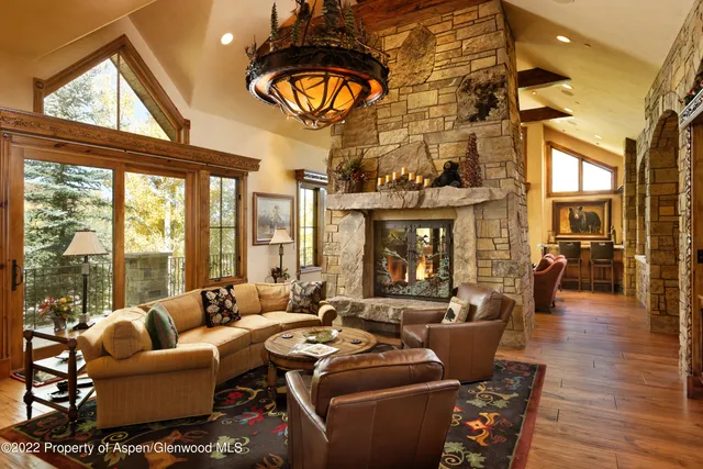 a very nice looking room with a large window and dining table