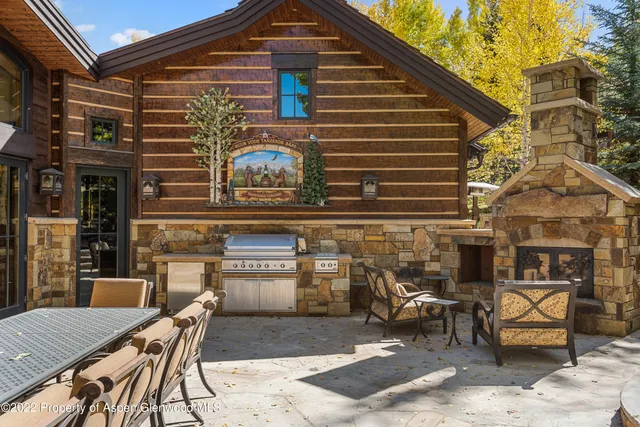 a bathroom with a double vanity sink a mirror and a shower